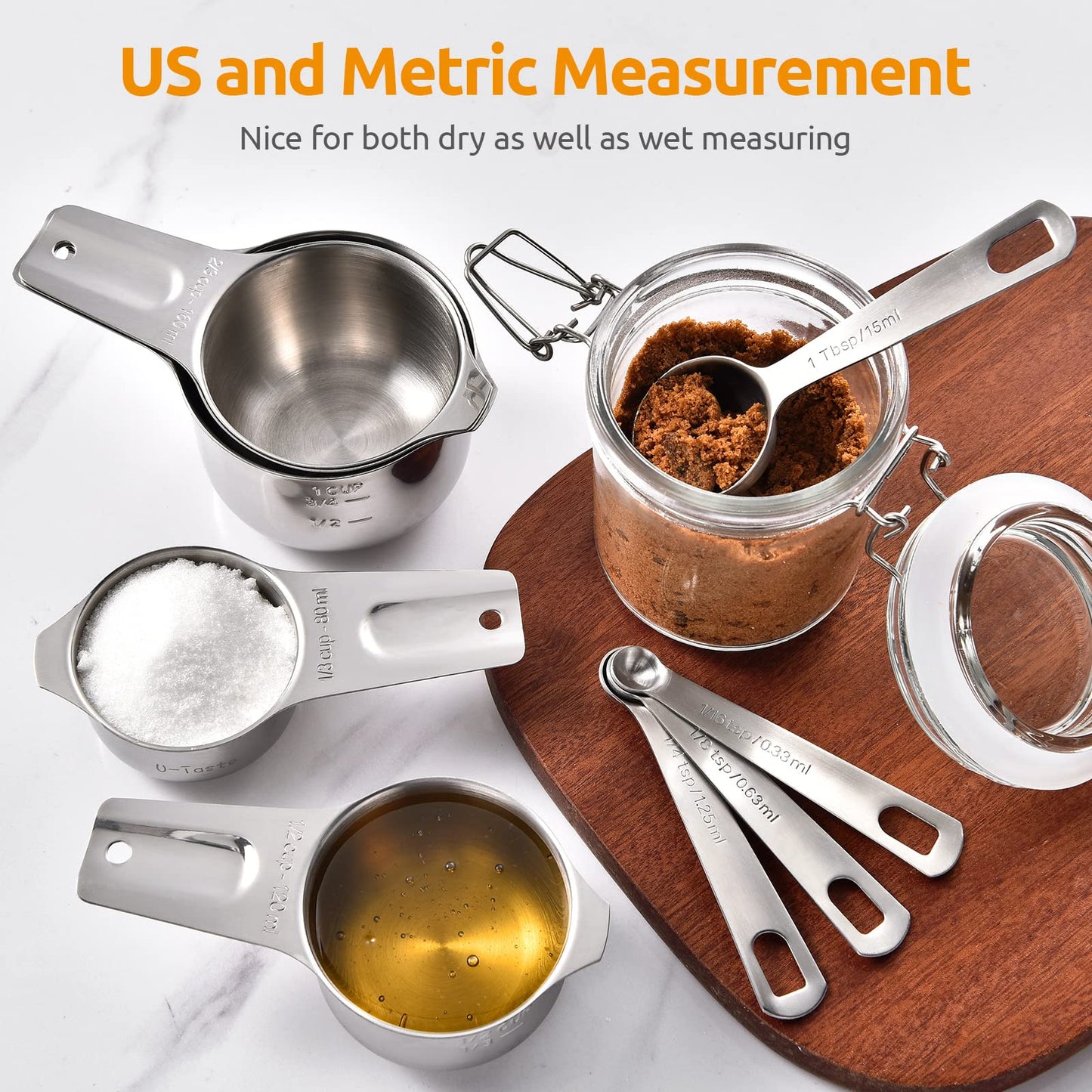 Set of measuring cups and spoons on a wooden board with ingredients, labeled for US and metric measurements.