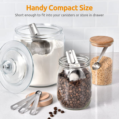 Glass jars with measuring spoons and contents on a white surface