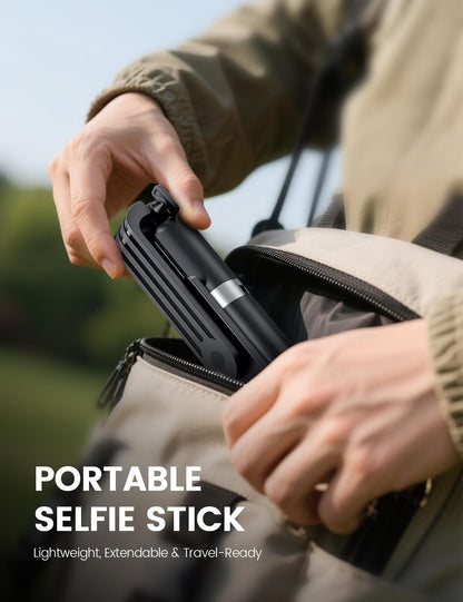ANXRE 41.7-inch extendable selfie stick and tripod in compact folding travel mode being packed into a backpack or bag