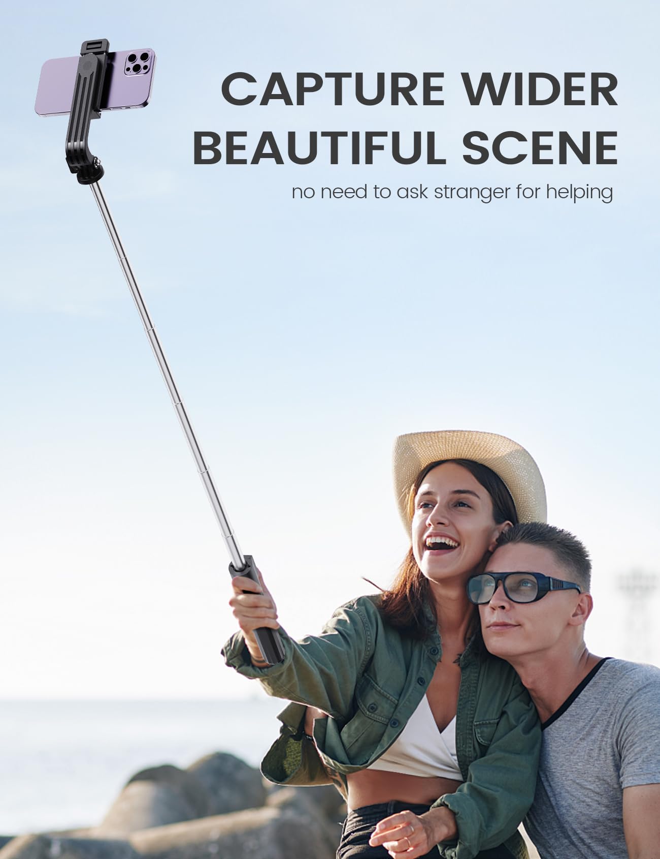 ANXRE 41.7-inch extendable selfie stick and tripod capturing a couple outdoors with scenic mountain and lake background views using the wireless remote