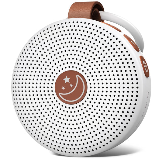 BodyHush Mini Portable White Noise Machine in white with a brown strap and moon logo resting on a soft surface.