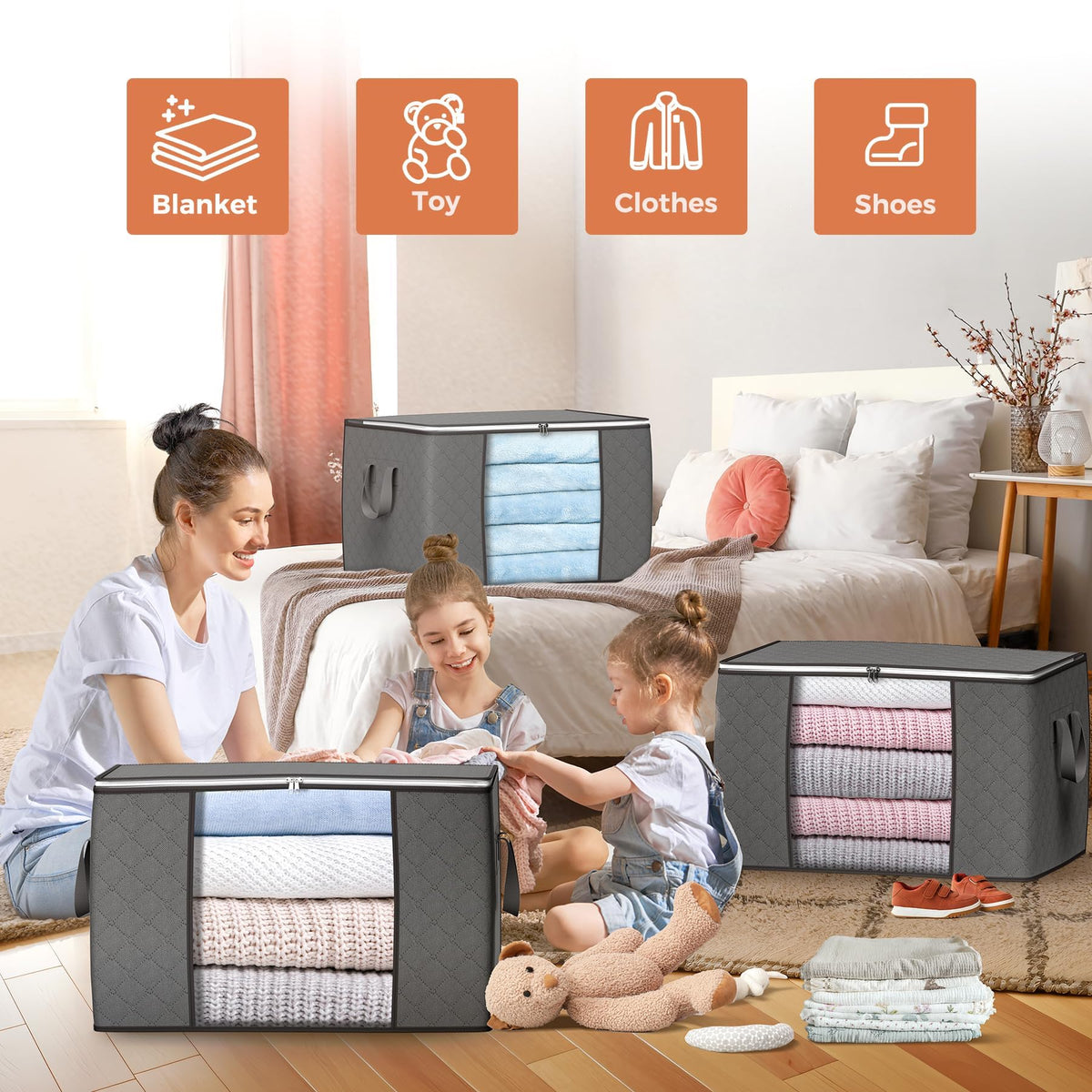 A young mother and two children organizing their bedroom using multiple Budding Joy grey foldable storage bags with clear windows, featuring icons for blankets, toys, clothes, and shoes.