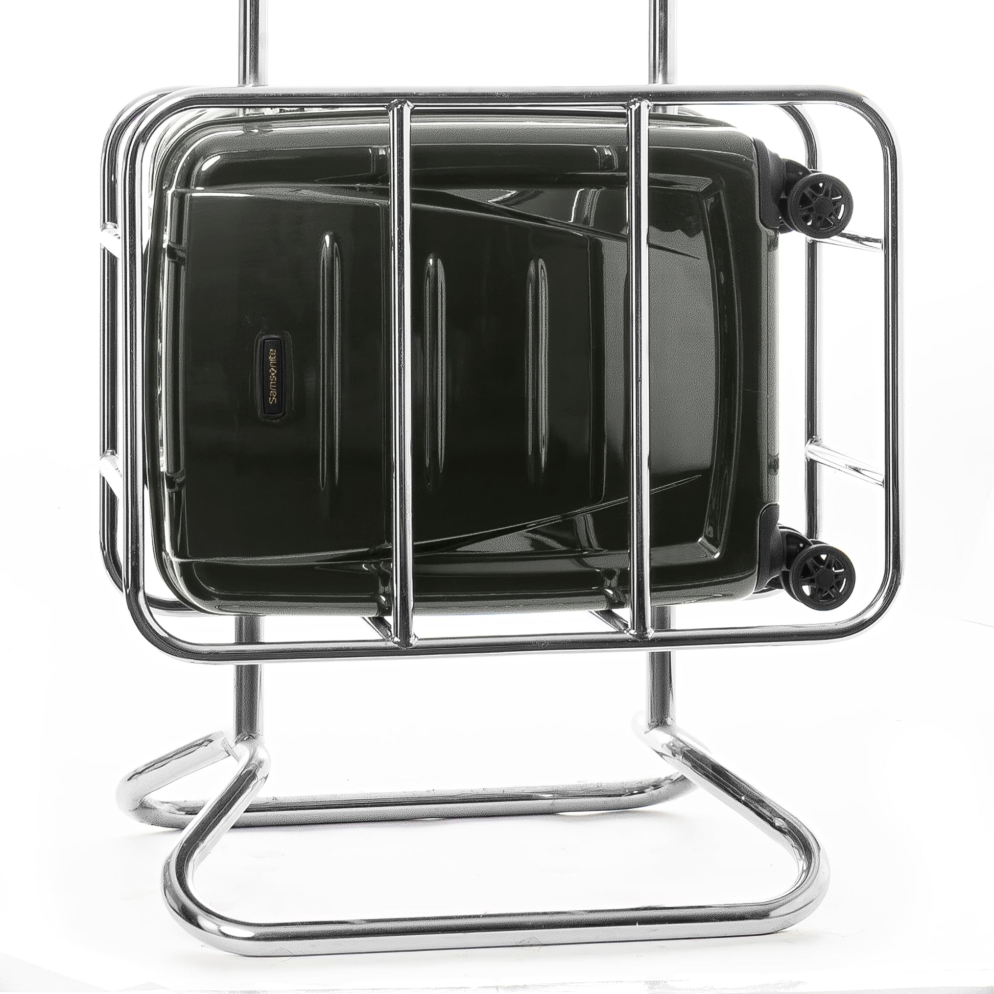 Samsonite Winfield 2 20-inch carry-on luggage fitting inside an airline overhead bin sizer cage