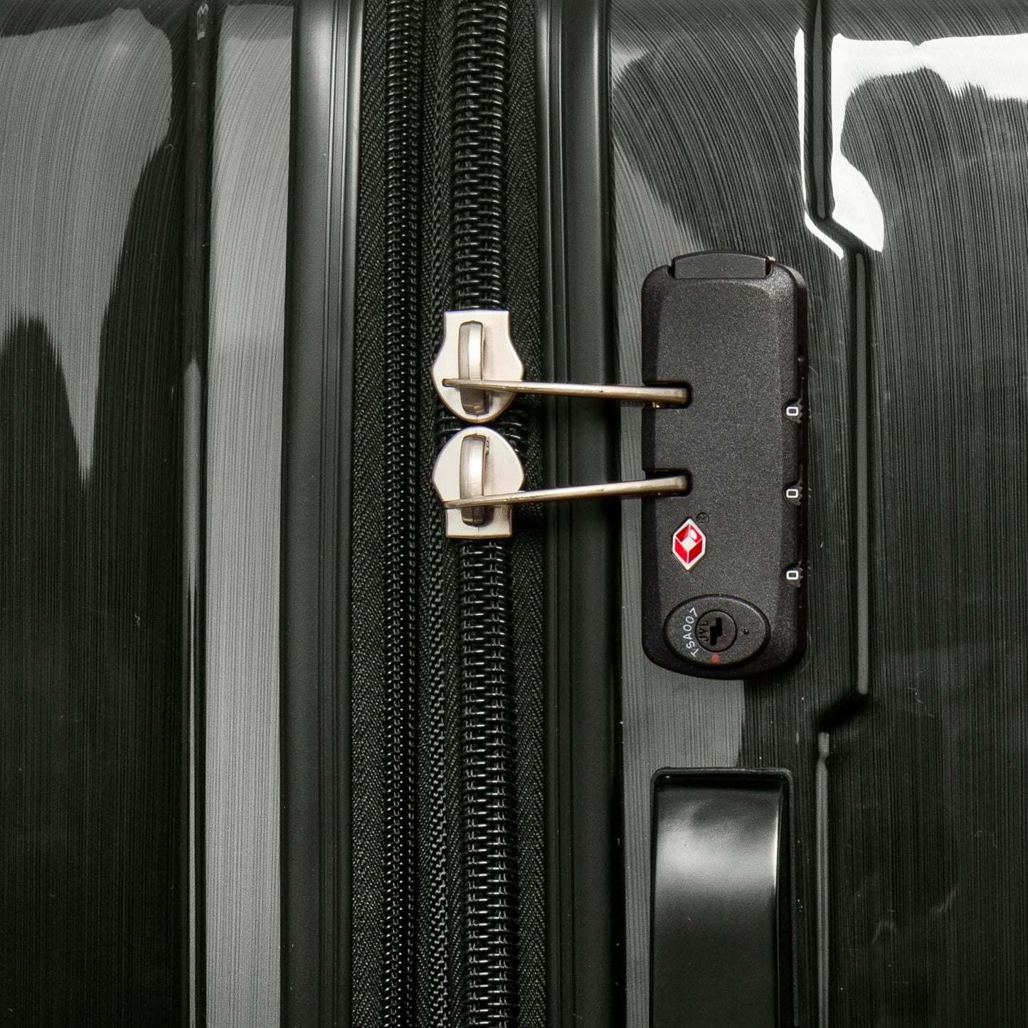 Close-up of side-mounted TSA-approved combination lock and heavy-duty zippers on Samsonite Winfield 2 luggage