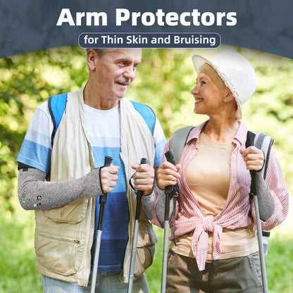 Elderly couple walking outdoors in a park wearing grey Schwer ANSI A6 cut-resistant arm protectors, highlighted as arm protectors for thin skin and bruising.