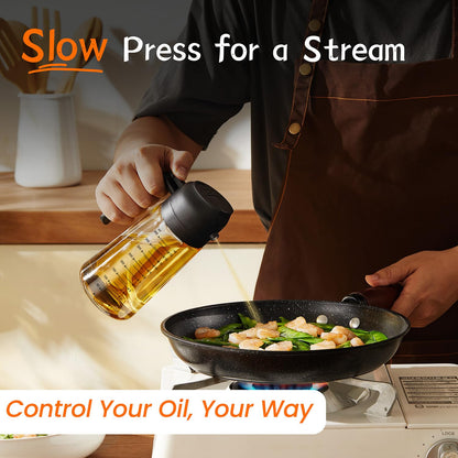 TrendPlain 470ml 2-in-1 glass oil dispenser demonstrating a steady stream with a slow press while cooking vegetables in a pan