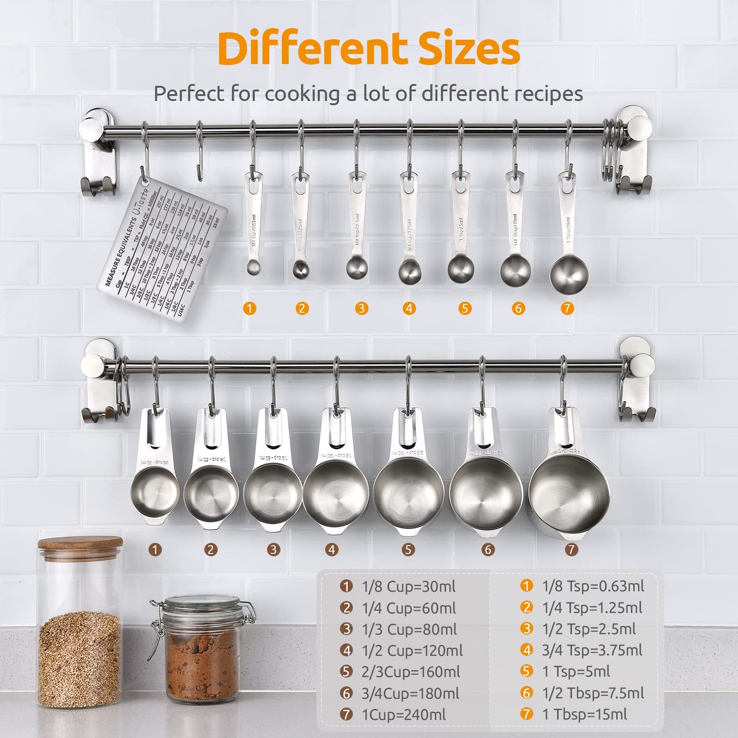Set of metal measuring cups and spoons hanging on a rack with size labels against a white tiled wall.