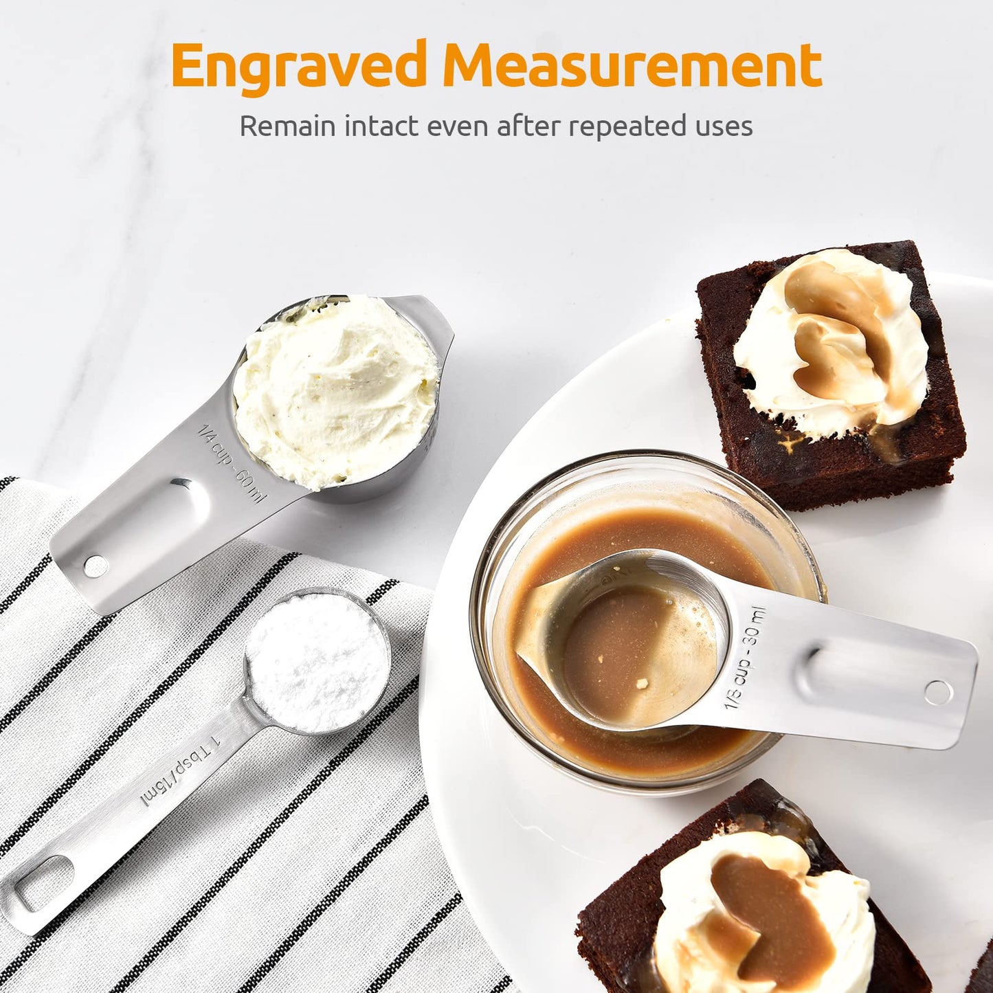 Measuring spoons with engravings on a dessert setting, emphasizing durability.