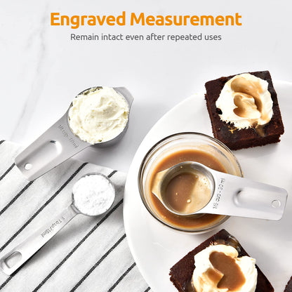 Measuring spoons with engravings on a dessert setting, emphasizing durability.