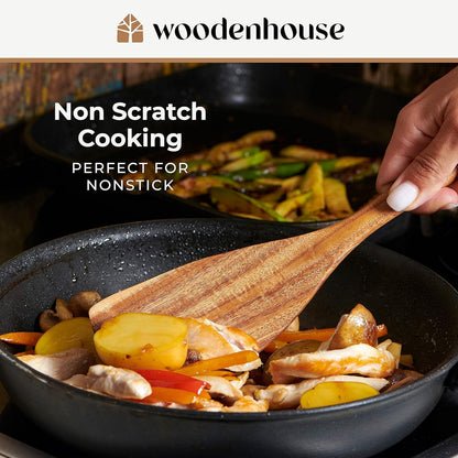 Woodenhouse natural teak wood spatula being used for non-scratch cooking in a frying pan with vegetables